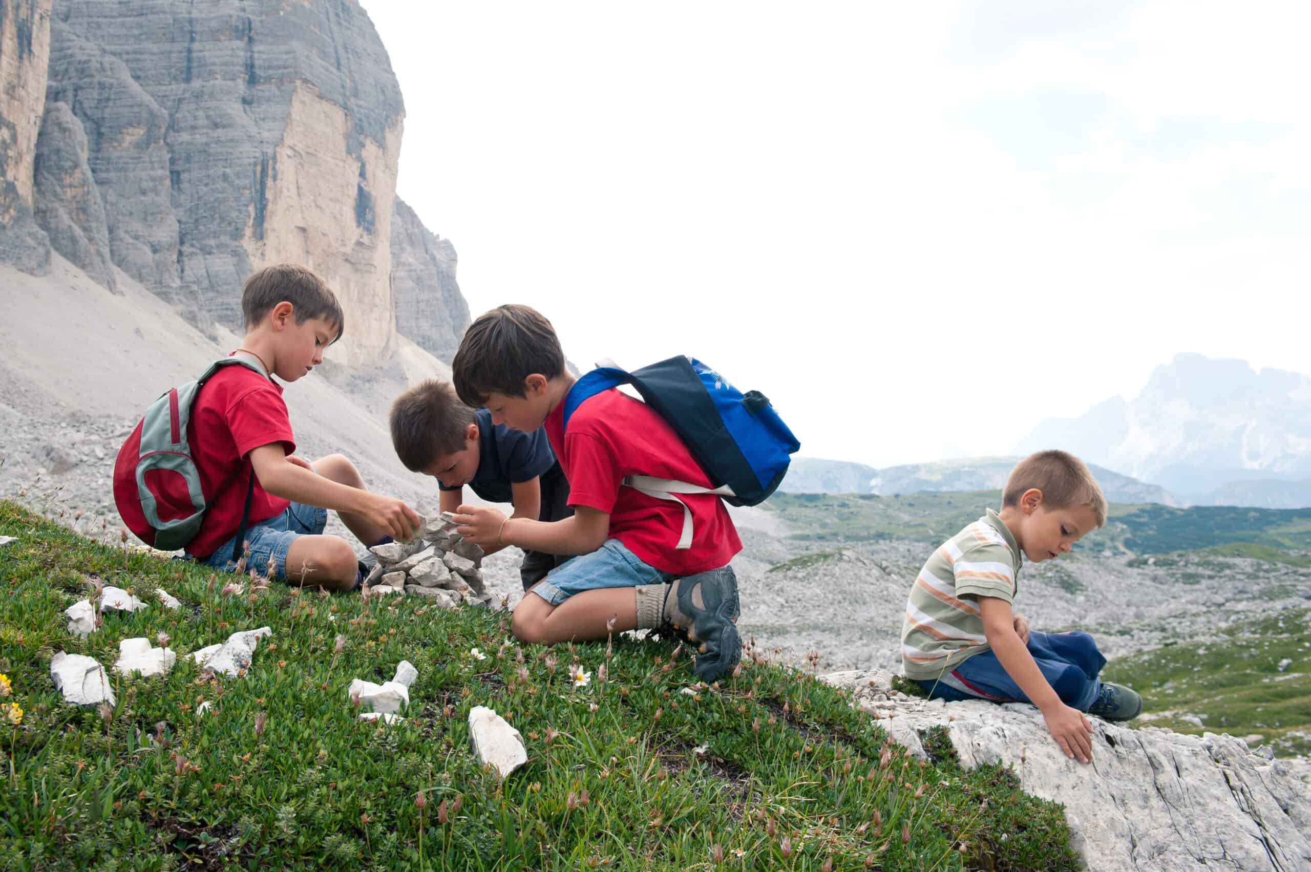 Kids playing in the mountains. Dolomites, Italy. Kids playing in the mountains. Dolomites, Italy.